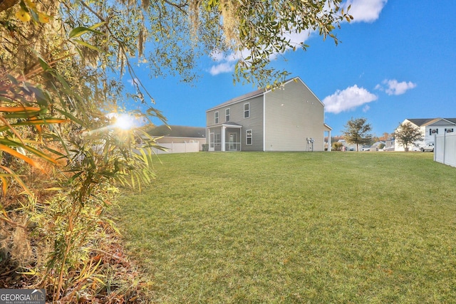 view of yard with a sunroom