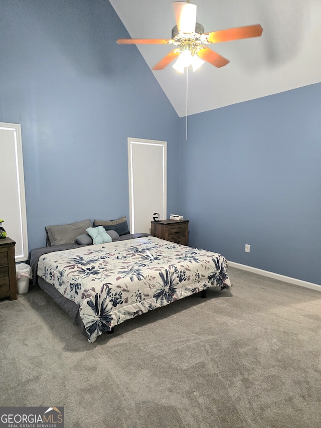 carpeted bedroom with high vaulted ceiling and ceiling fan