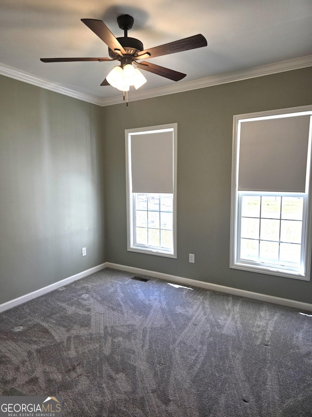 1080 Julian St, Bartow, GA 30413 - spare room featuring a ceiling fan, crown molding, baseboards, and carpet floors