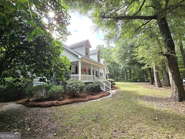 1080 Julian St, Bartow, GA 30413 - view of home's exterior with a yard and covered porch