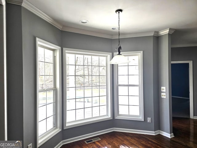 1080 Julian St, Bartow, GA 30413 - unfurnished dining area with visible vents, plenty of natural light, dark wood-type flooring, and baseboards