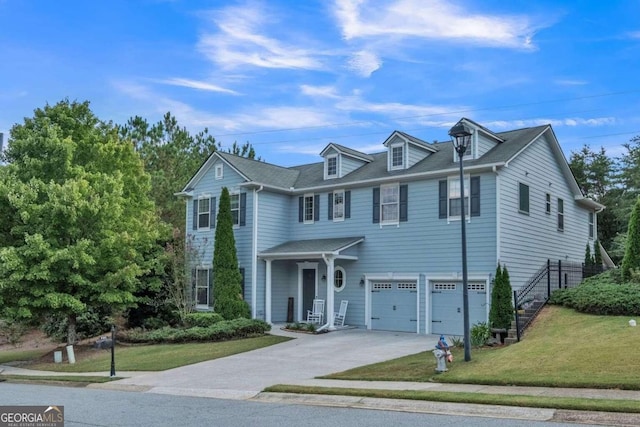 view of front facade featuring a garage and a front lawn