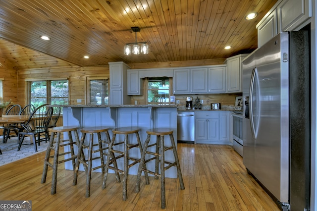 kitchen with white cabinets, sink, appliances with stainless steel finishes, wooden ceiling, and light wood-type flooring