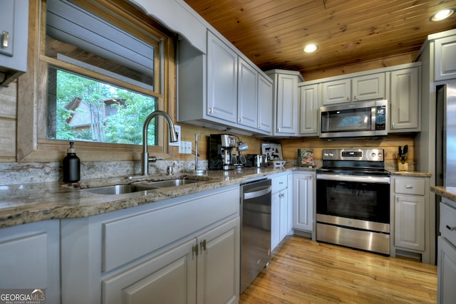 kitchen featuring light hardwood / wood-style floors, tasteful backsplash, stainless steel appliances, stone countertops, and wooden ceiling