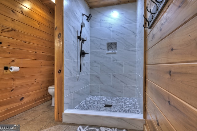 bathroom with wood walls and a bathtub