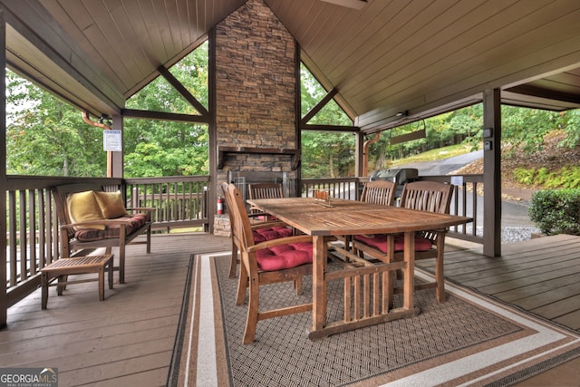 wooden terrace featuring a grill