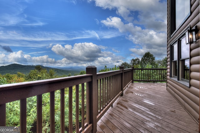 deck featuring a hot tub