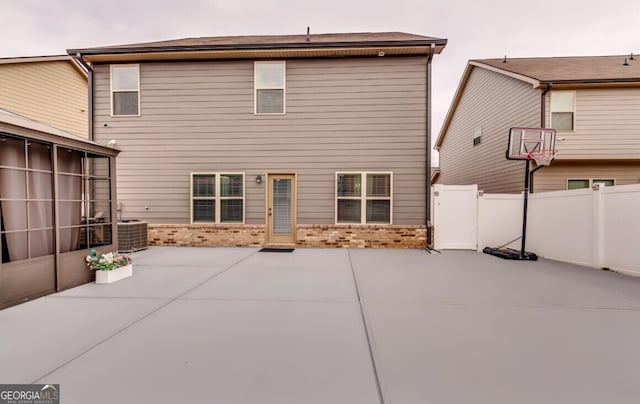 back of property featuring a patio and central air condition unit