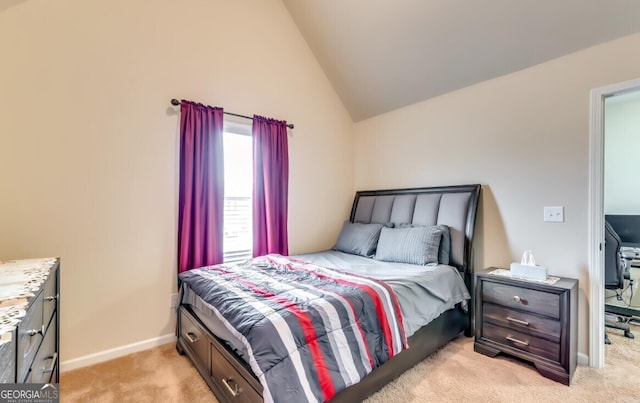 bedroom featuring light colored carpet and vaulted ceiling