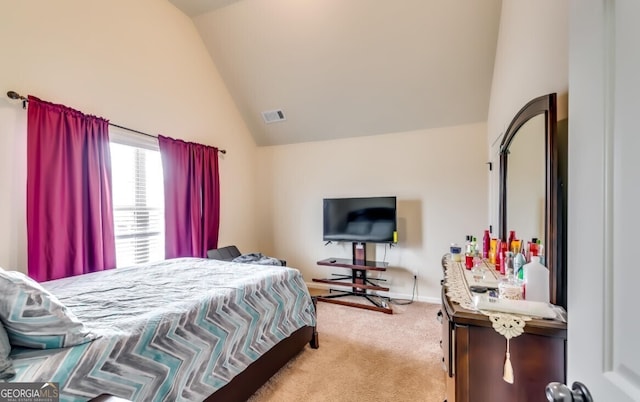 carpeted bedroom featuring high vaulted ceiling