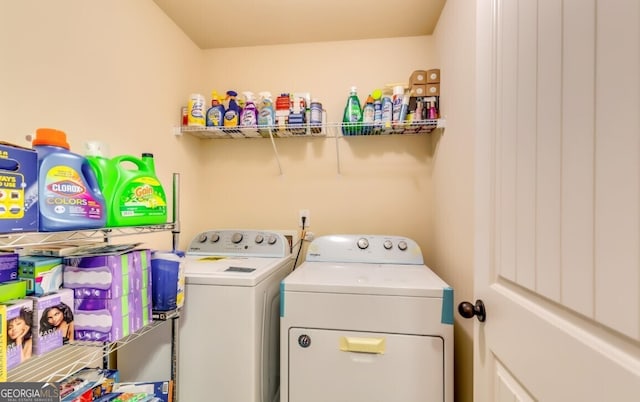 laundry room with separate washer and dryer