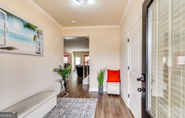 hall with ornamental molding and hardwood / wood-style flooring