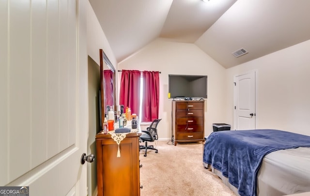 bedroom with vaulted ceiling and light carpet