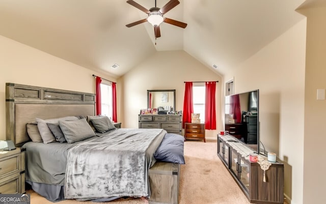 carpeted bedroom with vaulted ceiling and ceiling fan