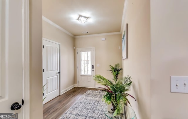 entryway with crown molding and wood-type flooring