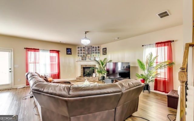 living room featuring light hardwood / wood-style floors and plenty of natural light