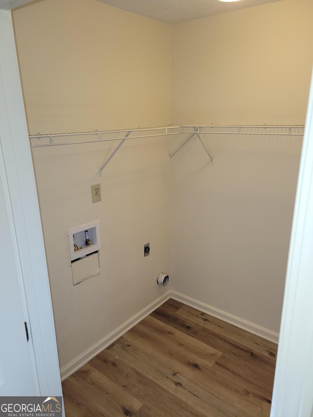 laundry room with hookup for an electric dryer, hookup for a washing machine, and hardwood / wood-style floors