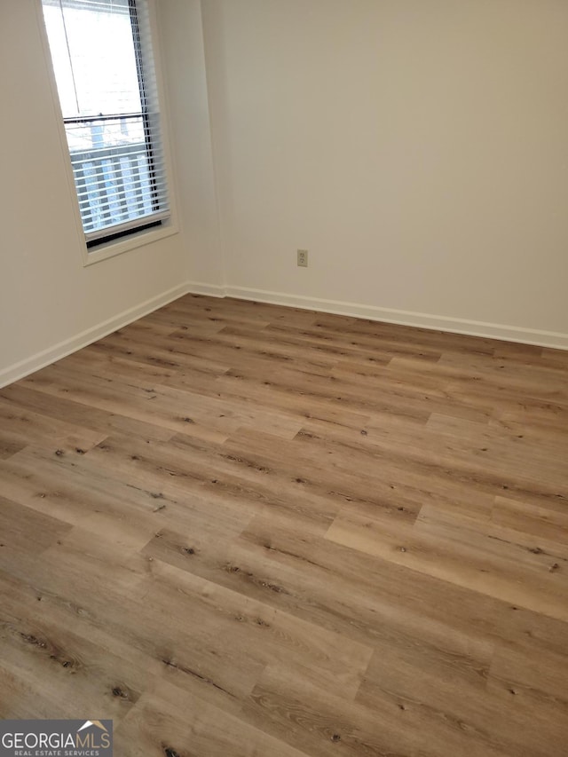 empty room with light wood-type flooring