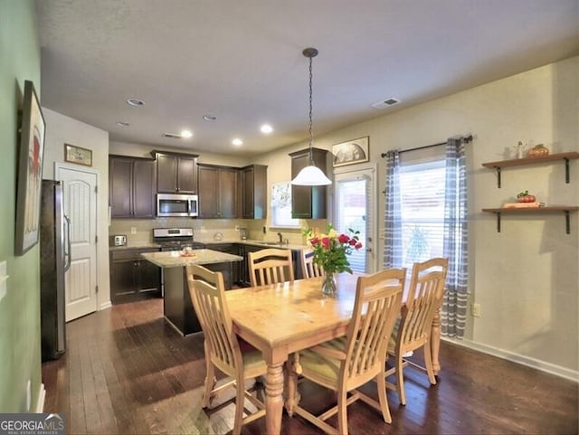 dining area featuring dark hardwood / wood-style floors