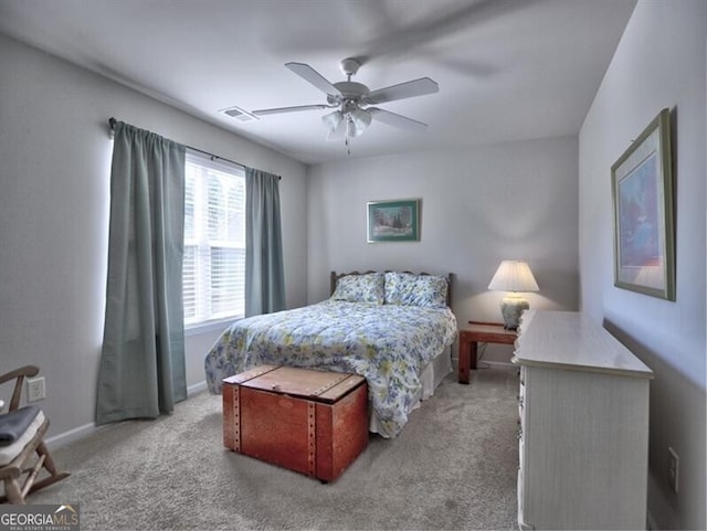 carpeted bedroom with ceiling fan