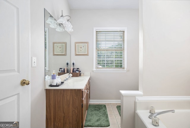 bathroom featuring a bathtub, tile patterned flooring, and vanity