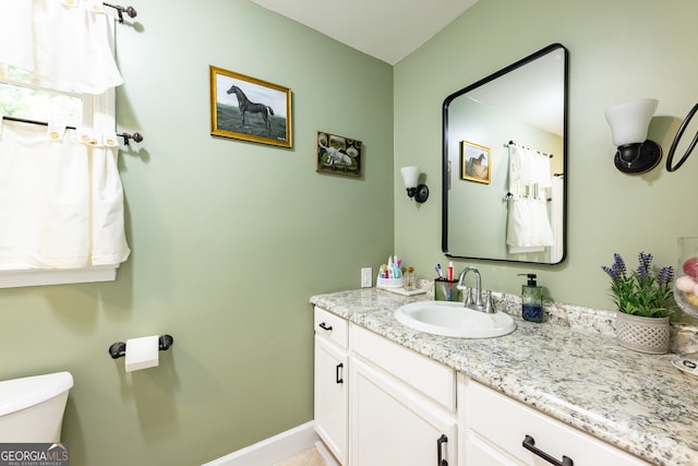 bathroom with vanity and toilet