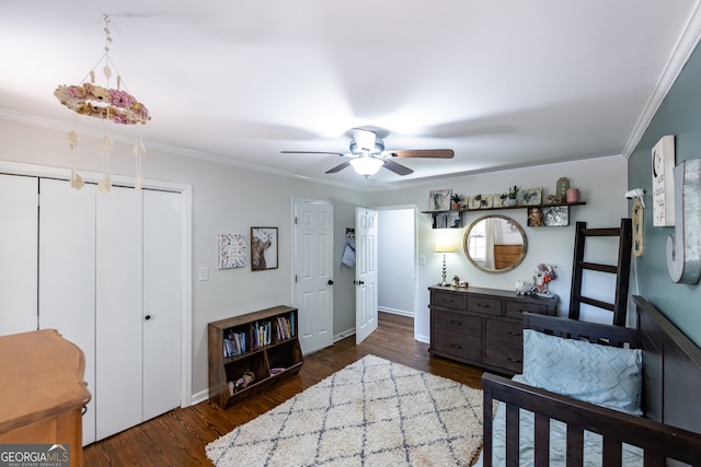 bedroom with dark hardwood / wood-style floors, ceiling fan, and ornamental molding