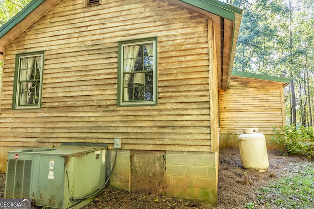 view of side of property with central AC