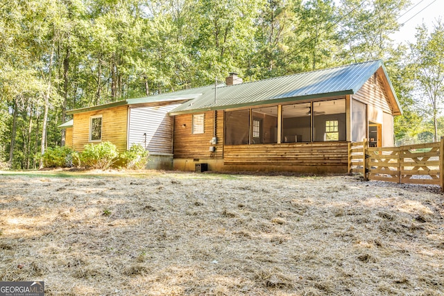 view of front of property featuring a sunroom