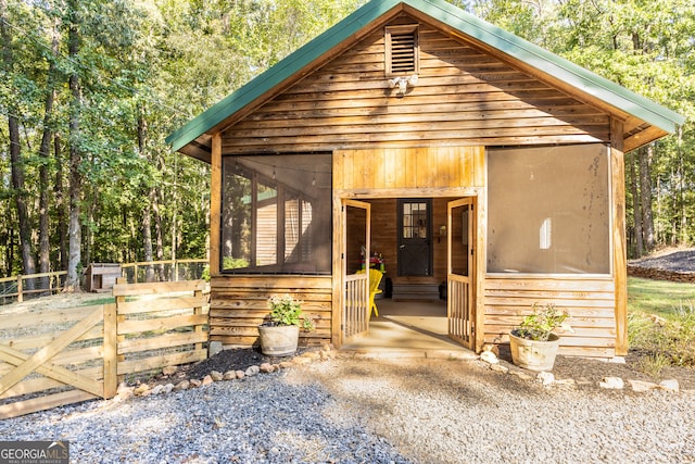 view of front of house featuring a sunroom