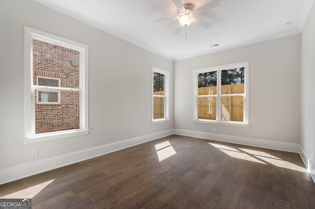 unfurnished room with ceiling fan, crown molding, and dark hardwood / wood-style flooring