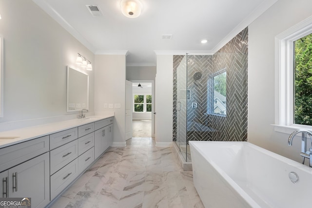 bathroom featuring crown molding, shower with separate bathtub, vanity, and plenty of natural light