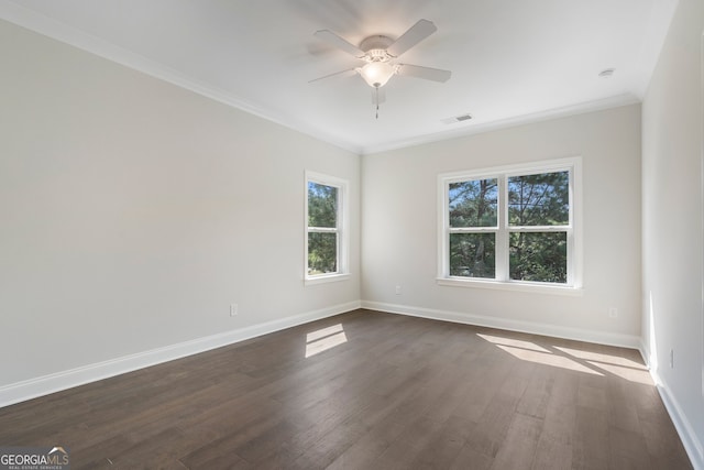 unfurnished room featuring ceiling fan, crown molding, and dark hardwood / wood-style flooring