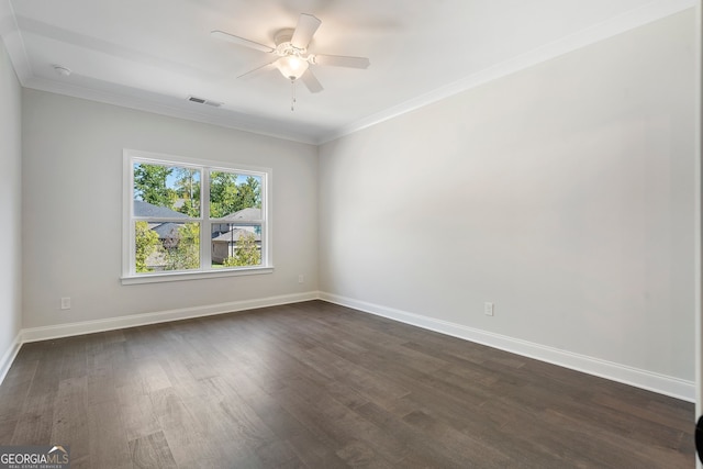 spare room featuring crown molding, dark hardwood / wood-style floors, and ceiling fan