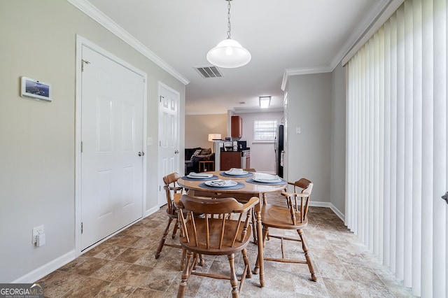 dining room with crown molding