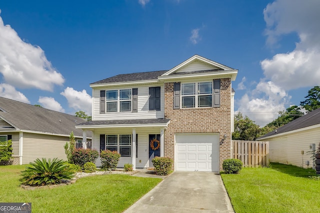 front of property featuring a front yard and a garage