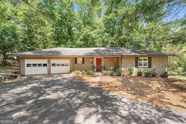 single story home with a garage