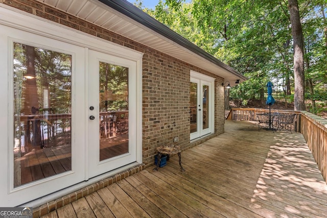 wooden terrace featuring french doors