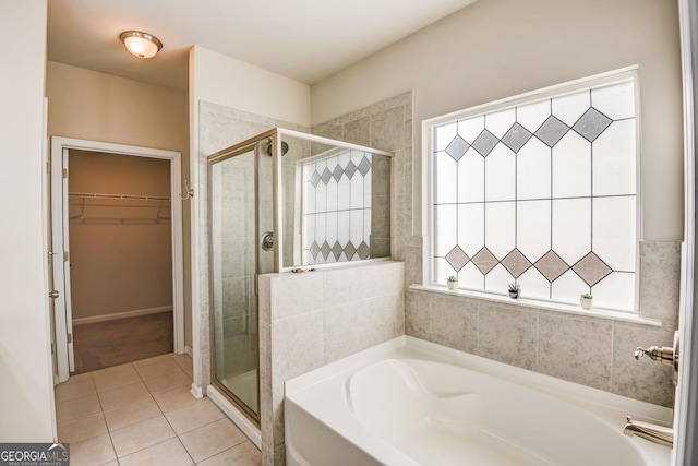 bathroom featuring independent shower and bath and tile patterned flooring