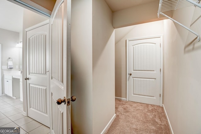 interior space featuring light carpet and sink