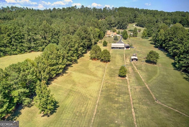 birds eye view of property with a rural view