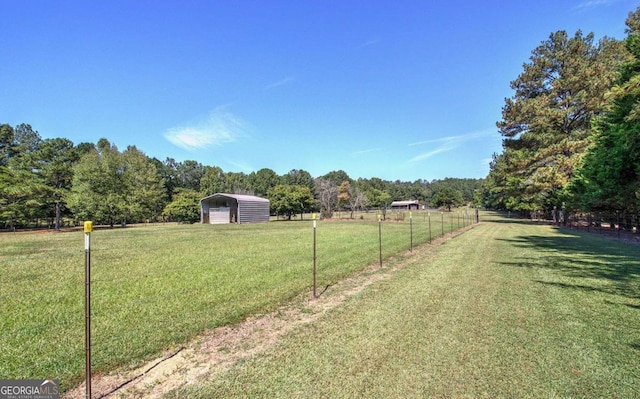 2051 Little Texas Valley Rd, Rome, GA 30165 - view of yard featuring a rural view, a carport, fence, and a wooded view