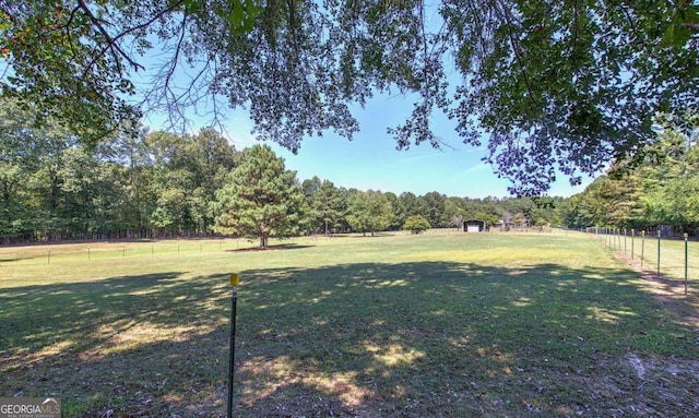 view of yard with a rural view