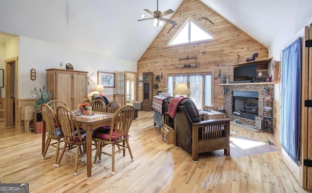 dining room featuring ceiling fan, high vaulted ceiling, and a healthy amount of sunlight