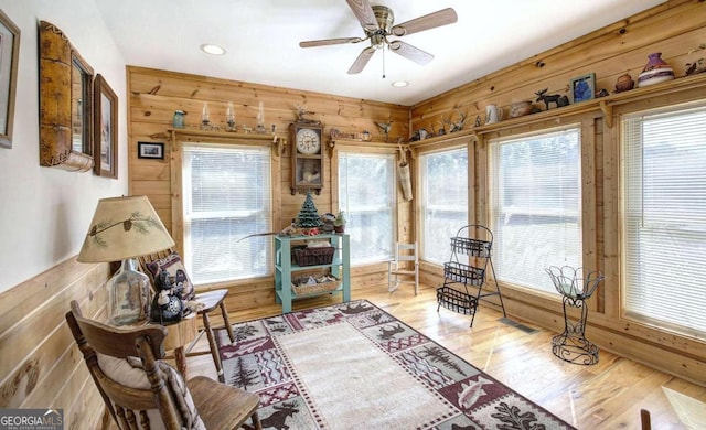 2051 Little Texas Valley Rd, Rome, GA 30165 - living area with wood walls, a wealth of natural light, and visible vents