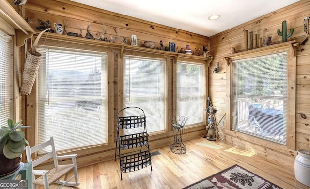 2051 Little Texas Valley Rd, Rome, GA 30165 - living area with wood walls, wood finished floors, and a healthy amount of sunlight