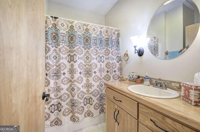 bathroom featuring tile patterned flooring and vanity