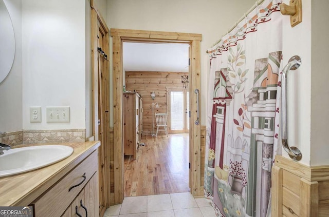 2051 Little Texas Valley Rd, Rome, GA 30165 - bathroom featuring wood walls, tile patterned floors, and vanity