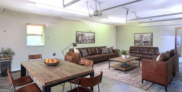 dining space featuring concrete flooring