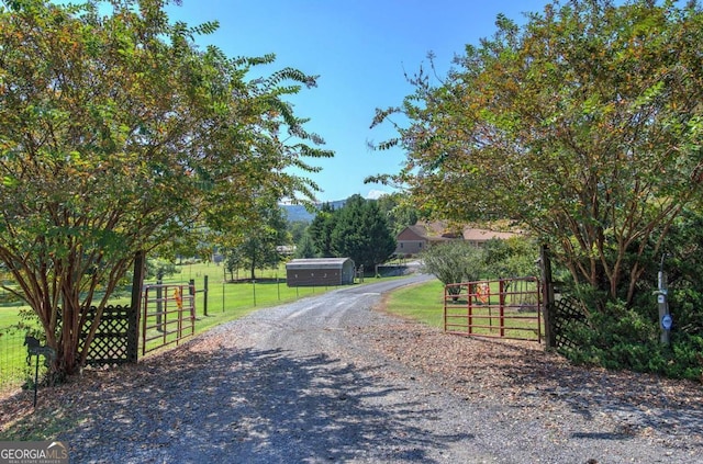 2051 Little Texas Valley Rd, Rome, GA 30165 - view of street with a gated entry, a gate, and gravel driveway